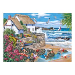 Seaspray Cottages puslespil af Keith Stapleton med et hus ved havet.
